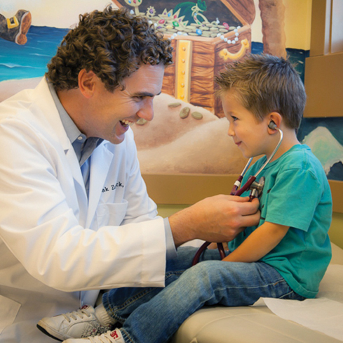 Image of a doctor and a child patient