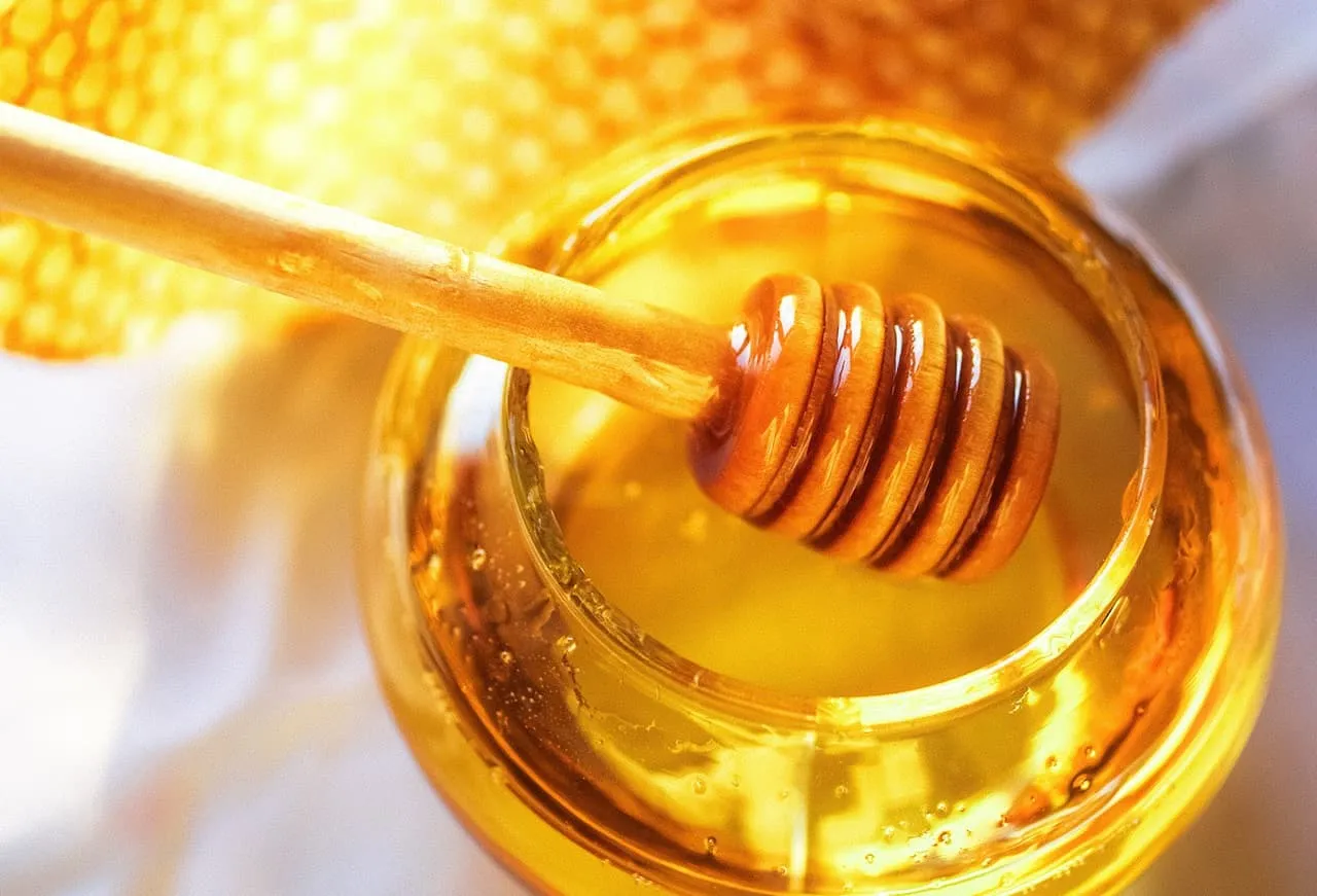 Natural honey in jar